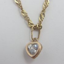 Ladies 9ct gold bracelet with a single heart shaped clear stone charm, combined 1.2g. UK P&P Group 0