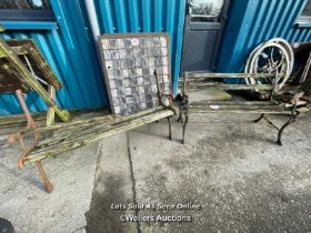 TWO GARDEN BENCHES WITH CAST IRON ENDS, IN NEED OF RESTORATION