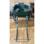 A VINTAGE TWO MAN HORSE CART WITH GREEN LEATHER CUSHIONED SEATING AND BACKREST, ON TWO WHEELS WITH