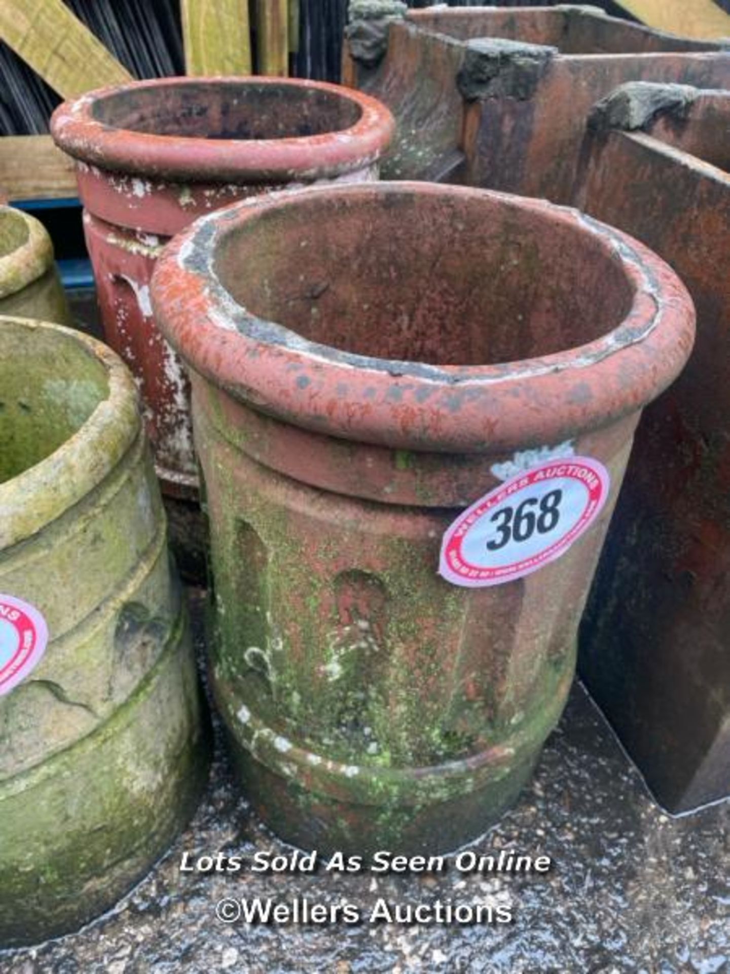 A PAIR OF TERRACOTTA COLUMN STYLE CHIMNEY POTS, 45CM (H)