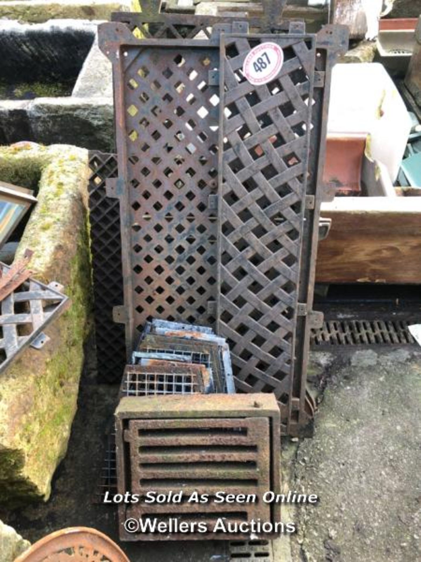 A QUANTITY OF CAST IRON GRATES AND COVERS