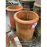 A PAIR OF ROLL TOP TERRACOTTA CHIMNEY POTS, 47CM (H)