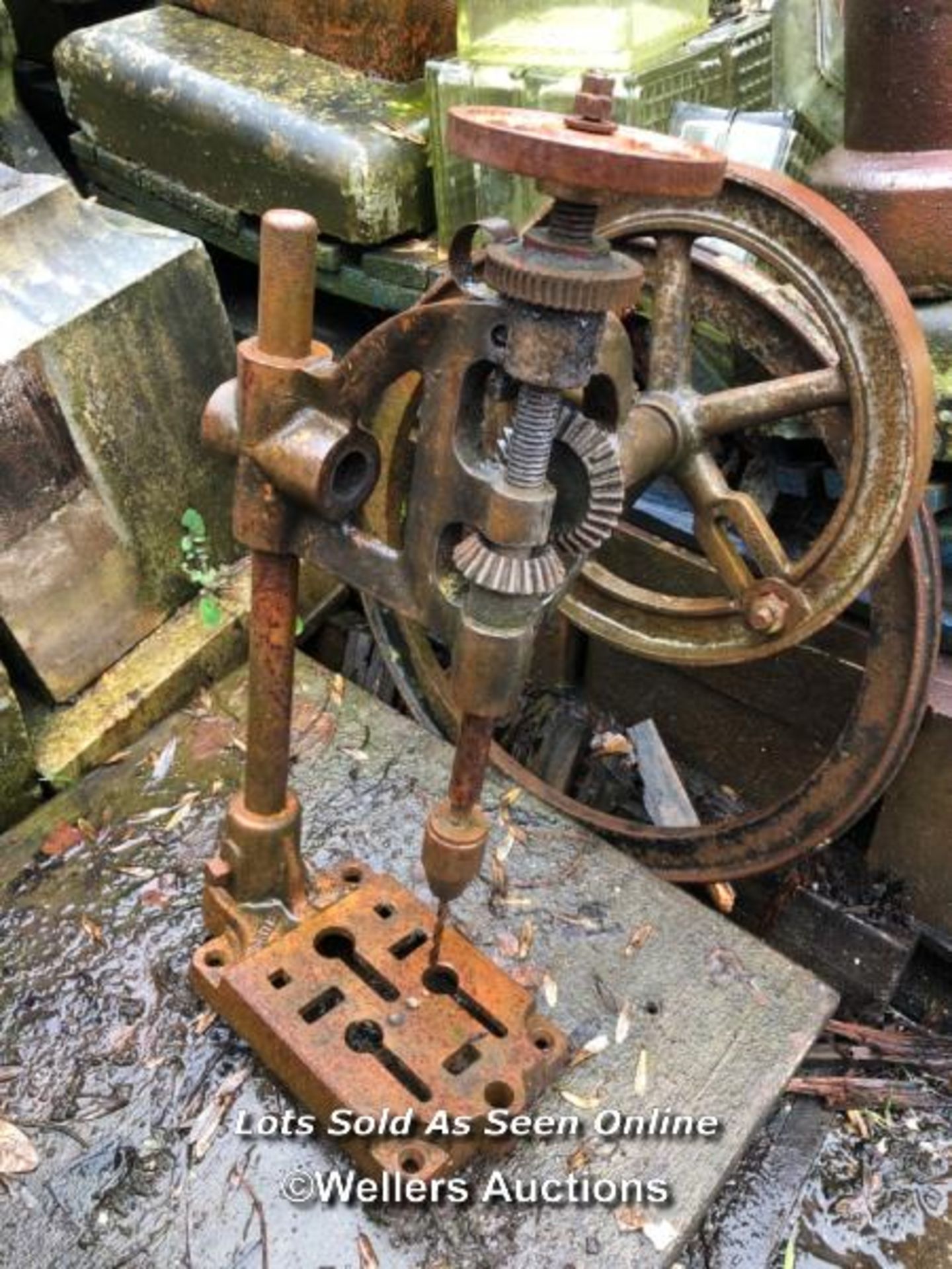 VINTAGE PILLAR DRILL AND HEAVY GEAR WHEEL ON STAND