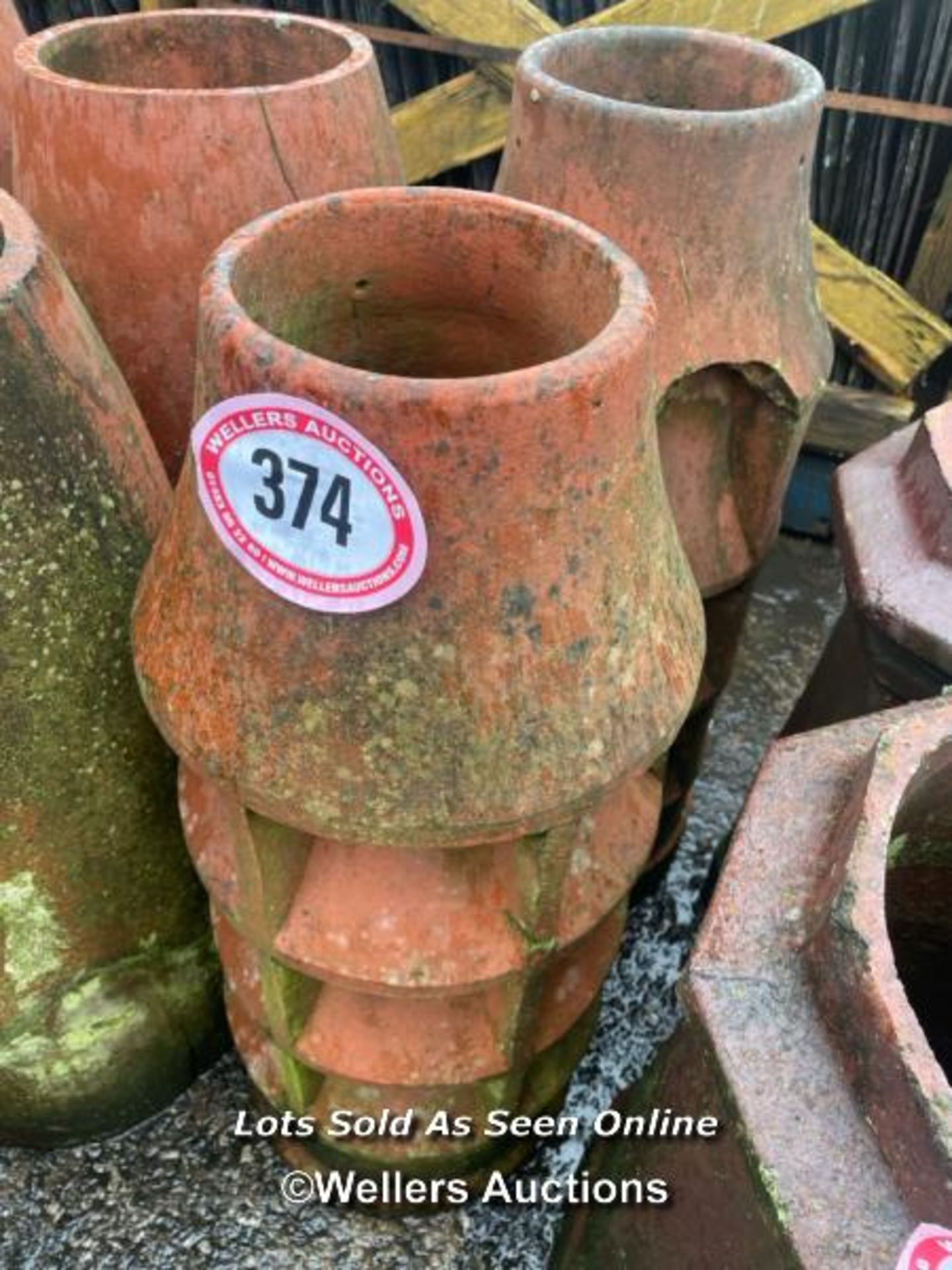 A PAIR OF FLUTED TERRACOTTA CHIMNEY POTS, 80CM (H)