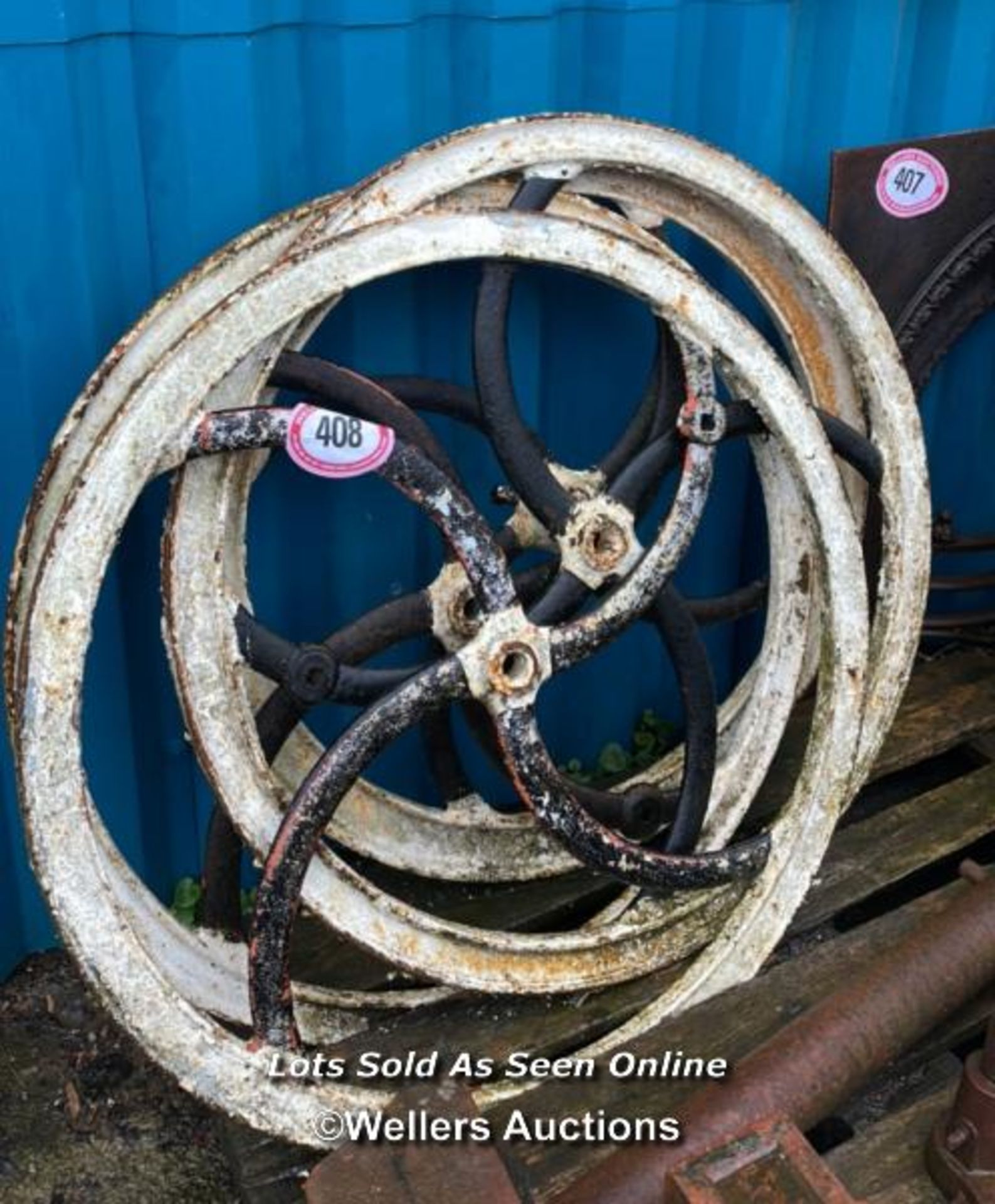 FOUR CAST IRON WHEELS 90CM (DIA)