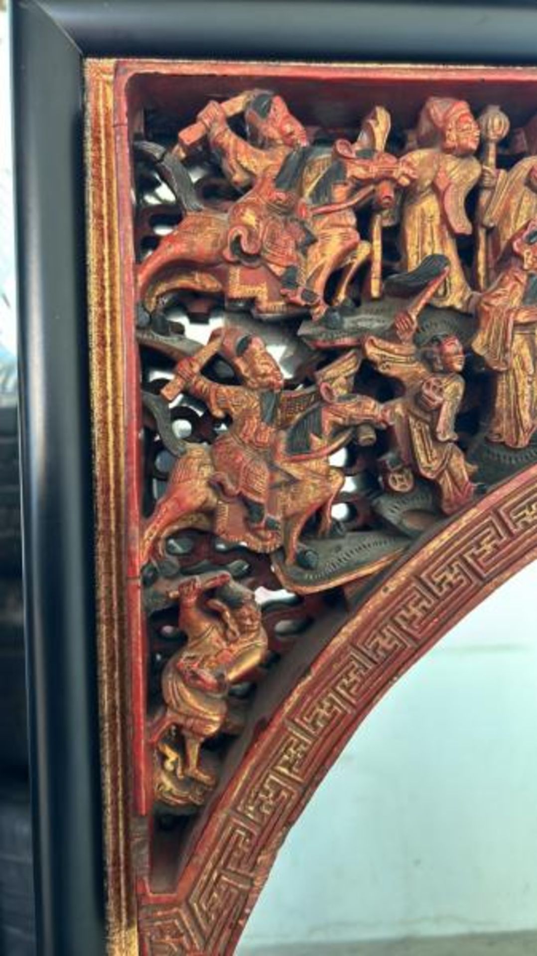 A carved and painted gilt Chinese mirror, with oriental figures in a relief arch at top, 65 x - Image 2 of 5