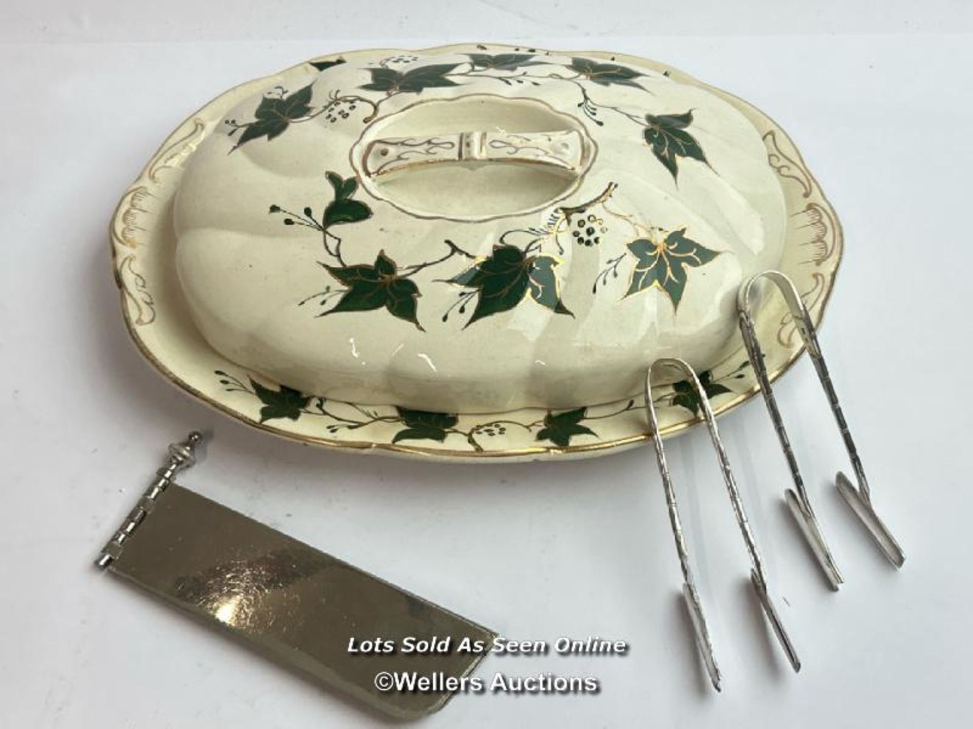 A pair of silve plate asparagus tongs and asparagus dish with a meatal three armed sandwich