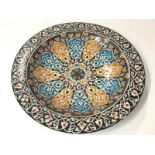 A large colourful hand painted glazed plate, 36cm diameter / AN3