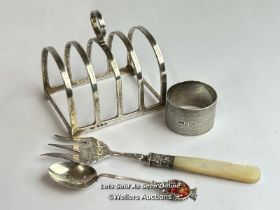 A collection of sterling silver including toast rack, napkin ring, silver & mother of pearl bread