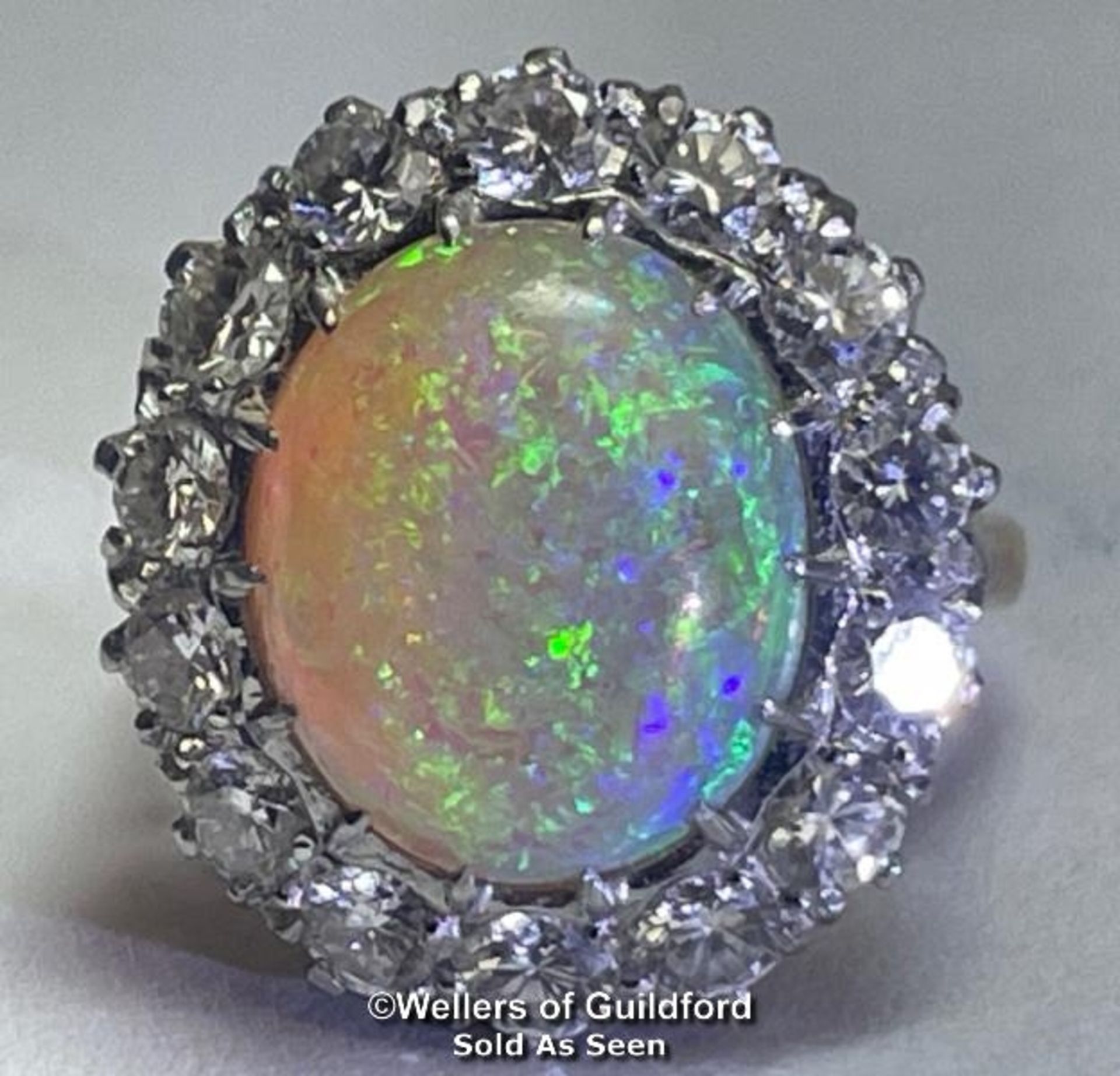 Opal and diamond cluster ring with an oval opal measuring 14.6mm x 12.2mm surrounded by 14 round - Image 7 of 24