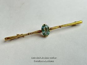 A boxed 15ct gold bar brooch set with a single aquamarine, 6cm wide / SF