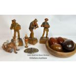 Three wooden figures of musicians, four wooden eggs in a bowl, miniature wooden pot with lid,