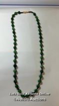 Jade bead necklace string knotted in contrast thread with gold plated hook clasp. Length 60cm, 8-8"