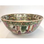 *A large early 20th centaury Chinese famille rose bowl decorated with a village scene, six character