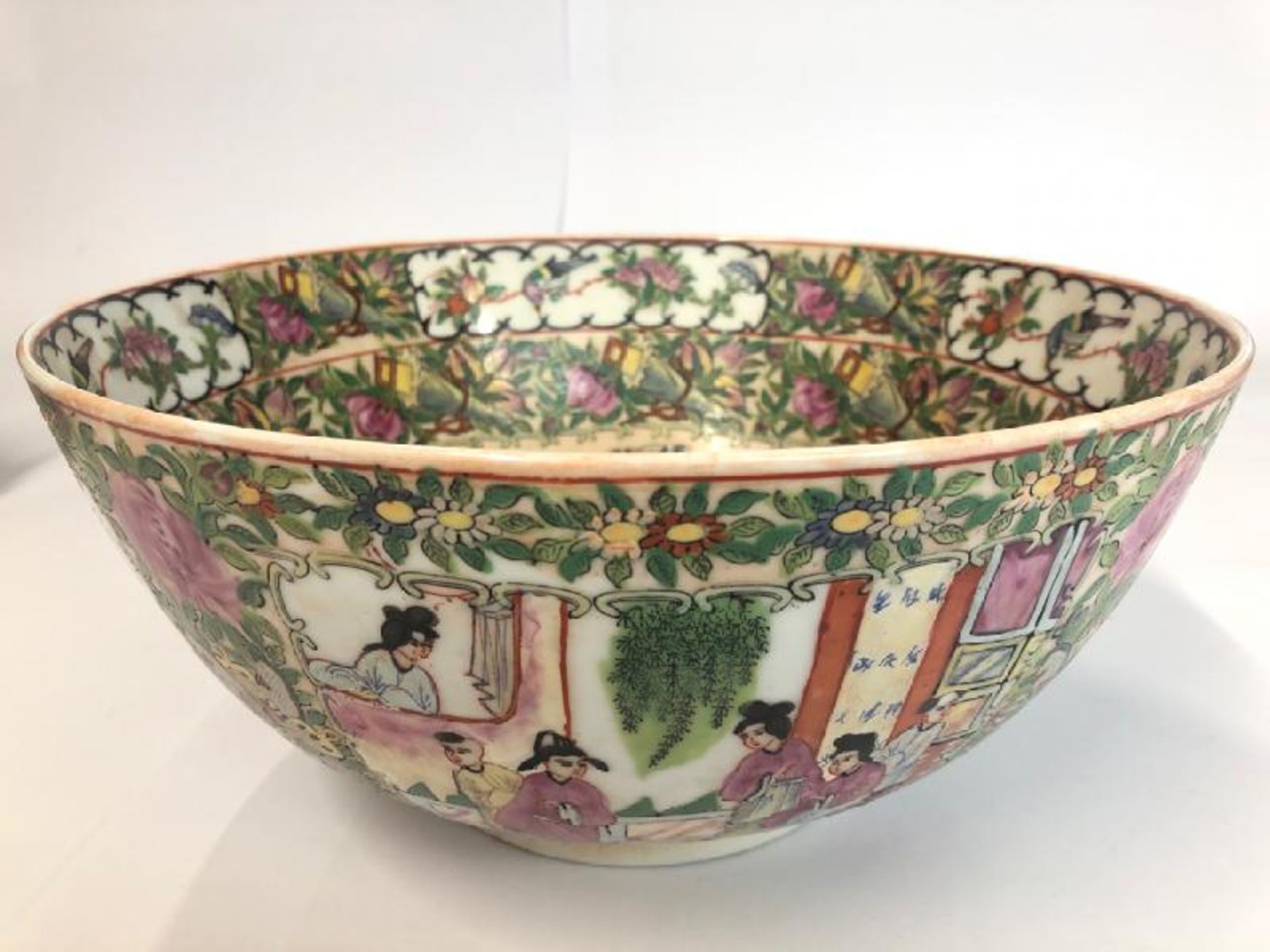 *A large early 20th centaury Chinese famille rose bowl decorated with a village scene, six character