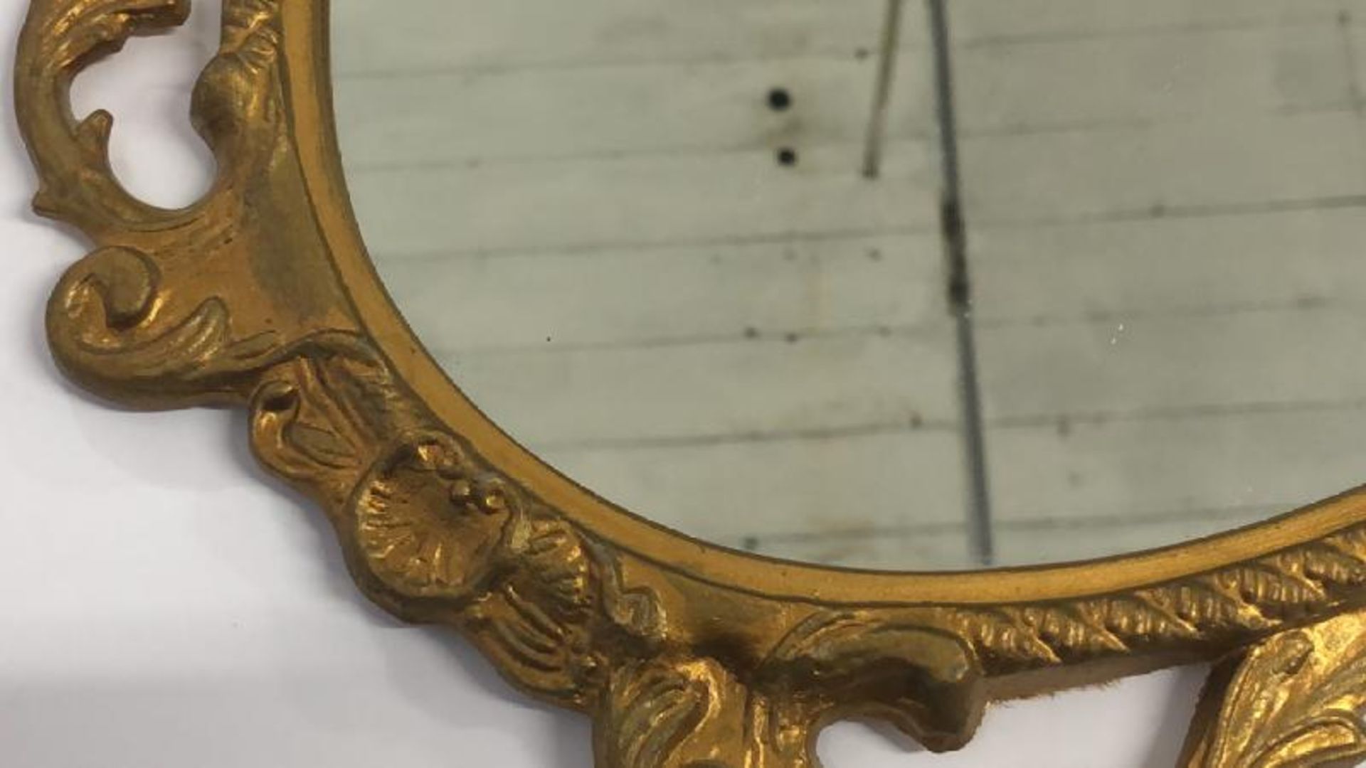 A small oval wall mirror with decorative metal frame, 48cm high - Image 4 of 5