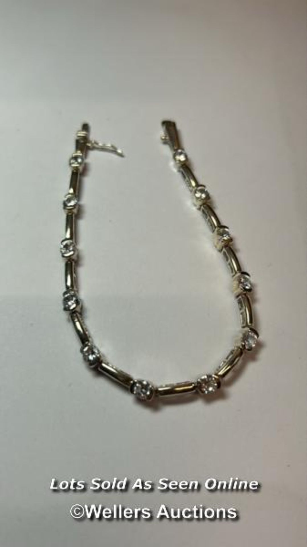 Hallmarked silver bracelet set with cubic zirconia, length 18cm / SF