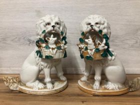 A pair of German porcelain Poodle dogs with baskets containing piglets, 19cm high / AN8