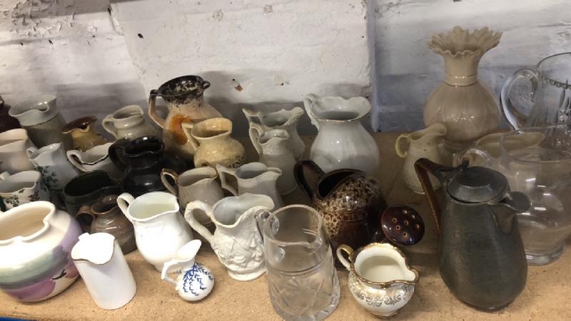 A large collection of assorted jugs including Belleek / AN42
