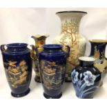 Six assorted vases including a large floor vase decorated with peacocks, 55cm high and a pair of
