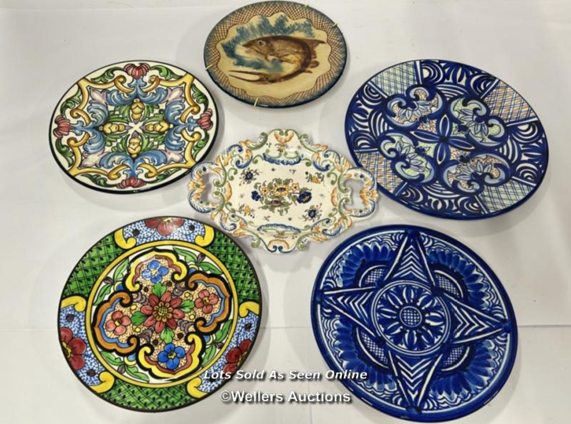 Six decorative hand painted plates, largest 31cm diameter / AN13