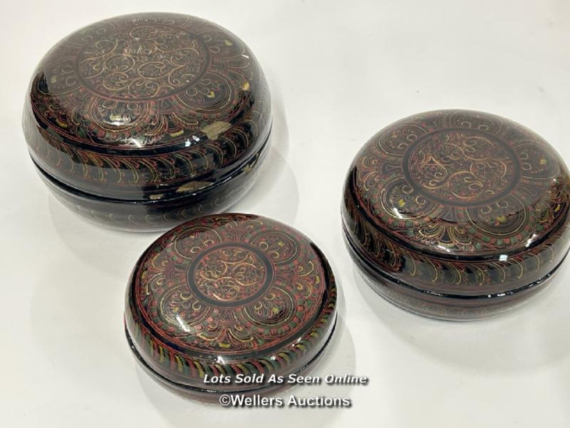 A decorative lacquer ware set of three round boxes, largest 15cm diameter / AN14