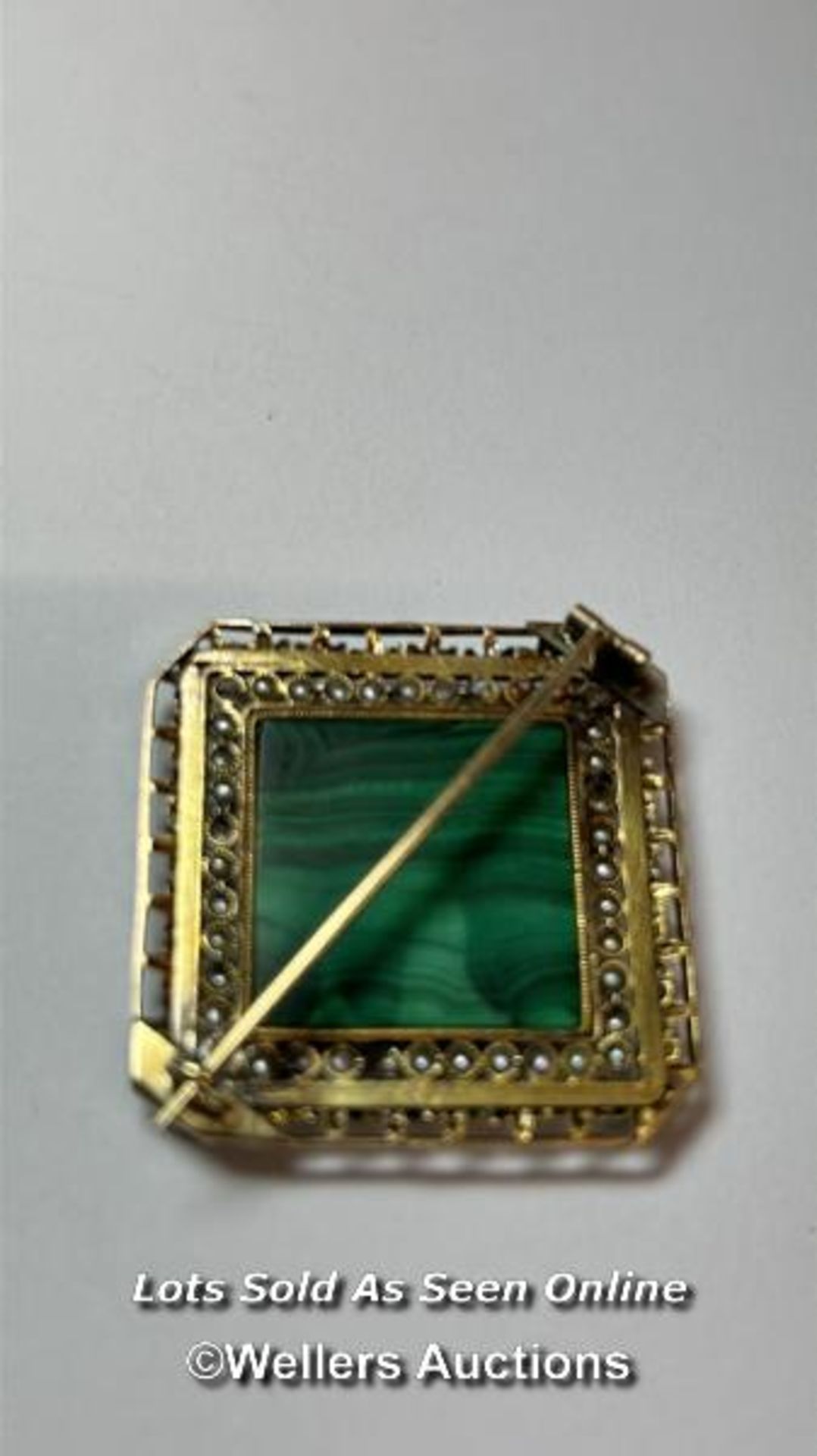 An antique brooch in yellow metal testing as 18ct gold, with centre set with malachite bordered by - Image 3 of 3