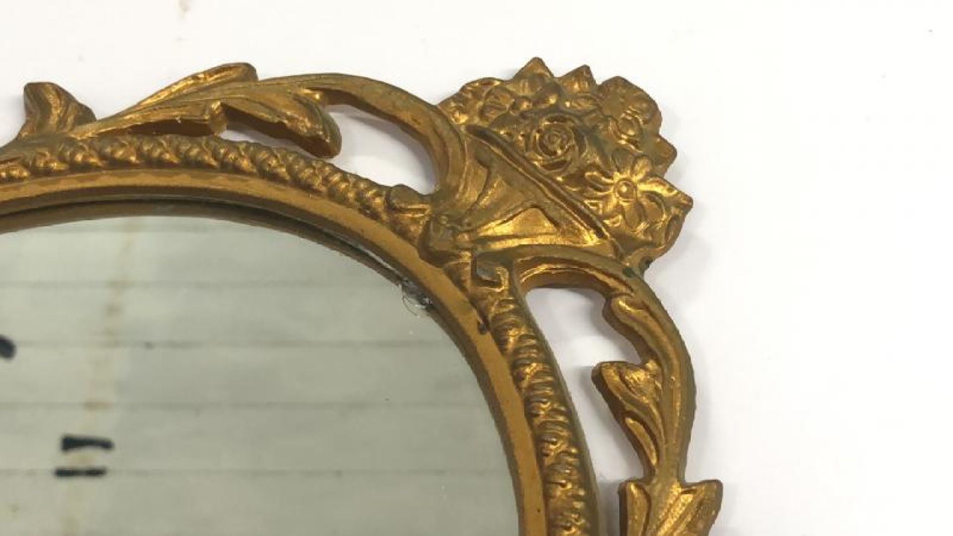 A small oval wall mirror with decorative metal frame, 48cm high - Image 2 of 5