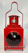 A nicely restored red railway London Transport rear lamp complete with reservoir and burner, 46cm