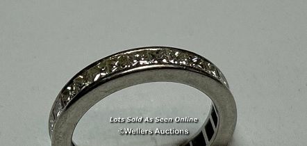 A princess cut diamond full eternity ring in hallmarked platinum, 2005. Estimated total diamond