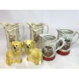 Four decorative ceramic jugs and a pair of porcelain dogs / AN8