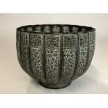 *Middle Eastern chased copper bowl with pearced rim, 15cm high, 18.5cm diameter (lot subject to
