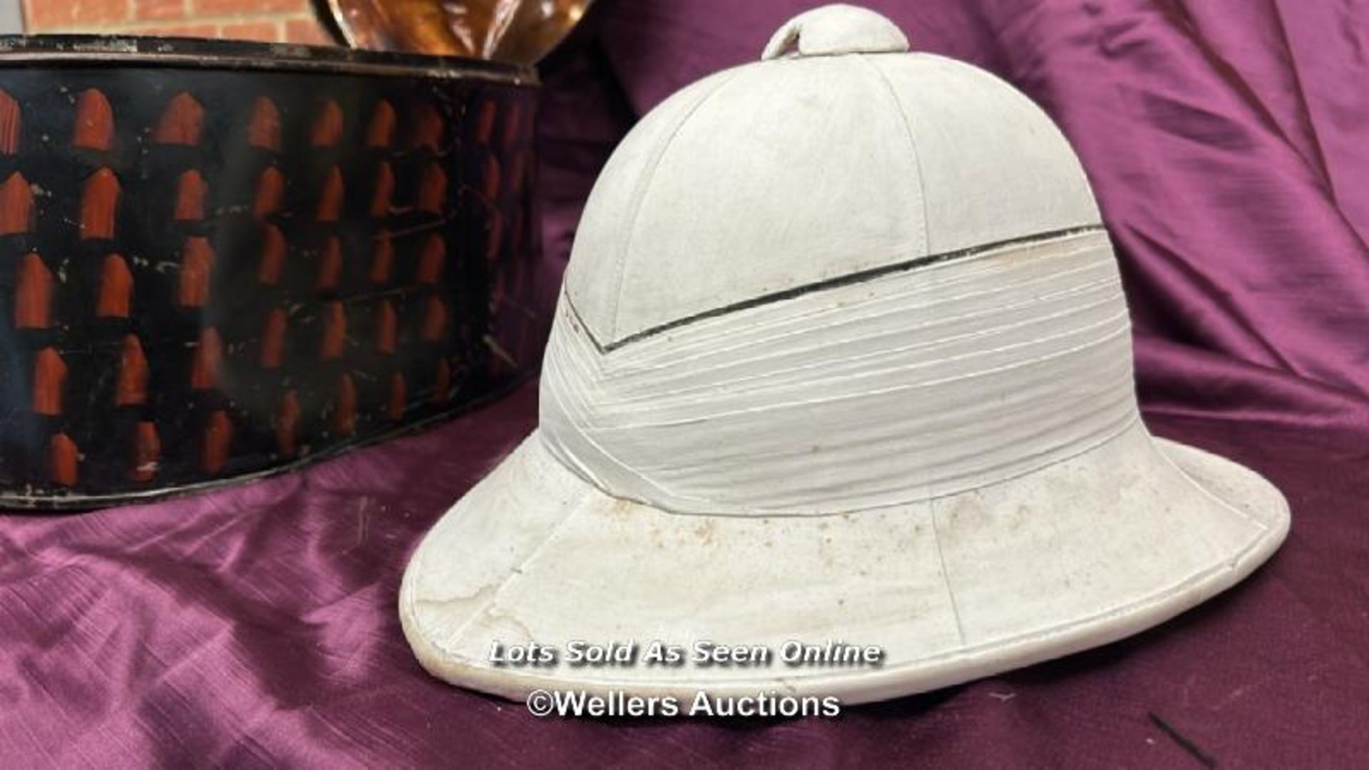 WORLD WAR TWO WOLSELEY TROPICAL HELMET WITH ORIGINAL TRANSPORTATION TIN BY GIEVES OF LONDON