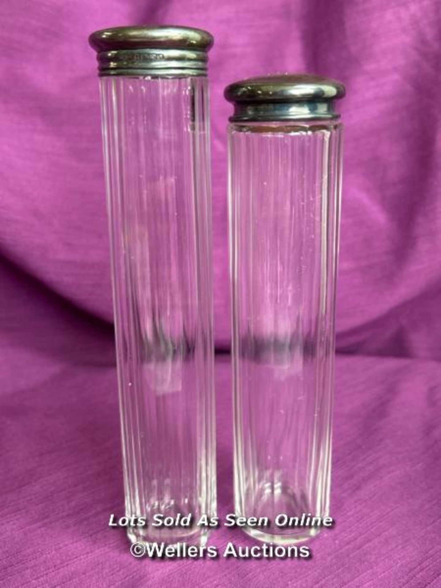 TWO HALLMARKED SILVER TOPPED AND CUT GLASS BEVELLED JARS, TALLEST 18CM, TOTAL SILVER WEIGHT 20GMS