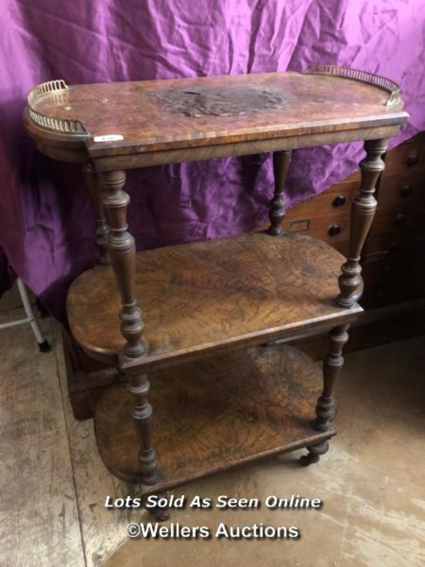 THREE TIER SHELF WITH FIGURE WALNUT VENEERED ON TURNED SUPPORTS, RESTORATION TO TOP SHELF