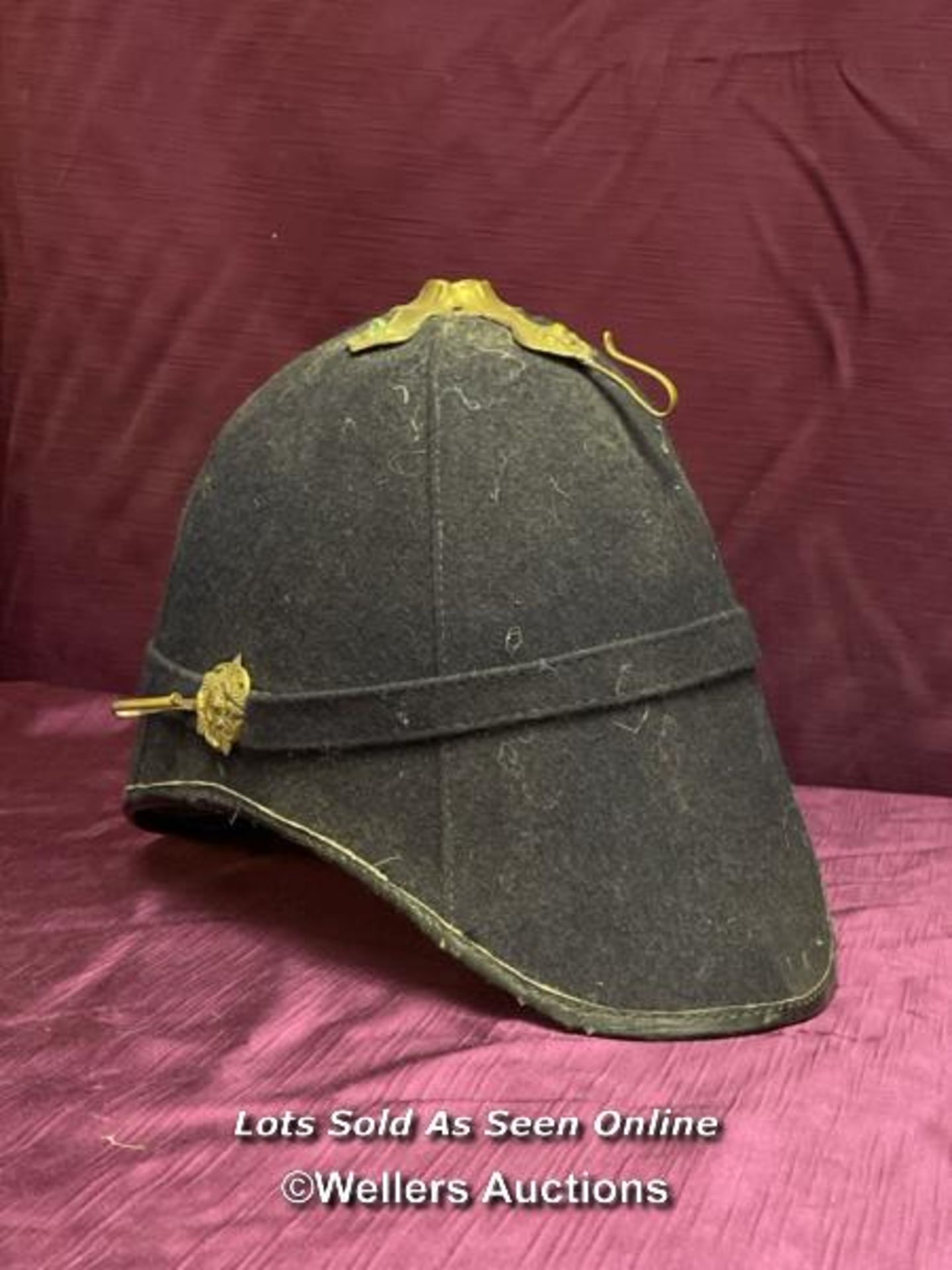 A HOME SERVICE PATTERNED HELMET, PROBABLY THEATRICAL USE