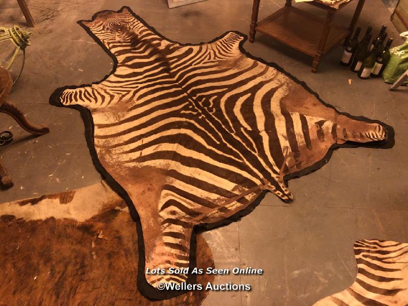 CIRCA 1910 GREVY'S BROWN AND WHITE ZEBRA SKIN RUG, 250 X 182CM