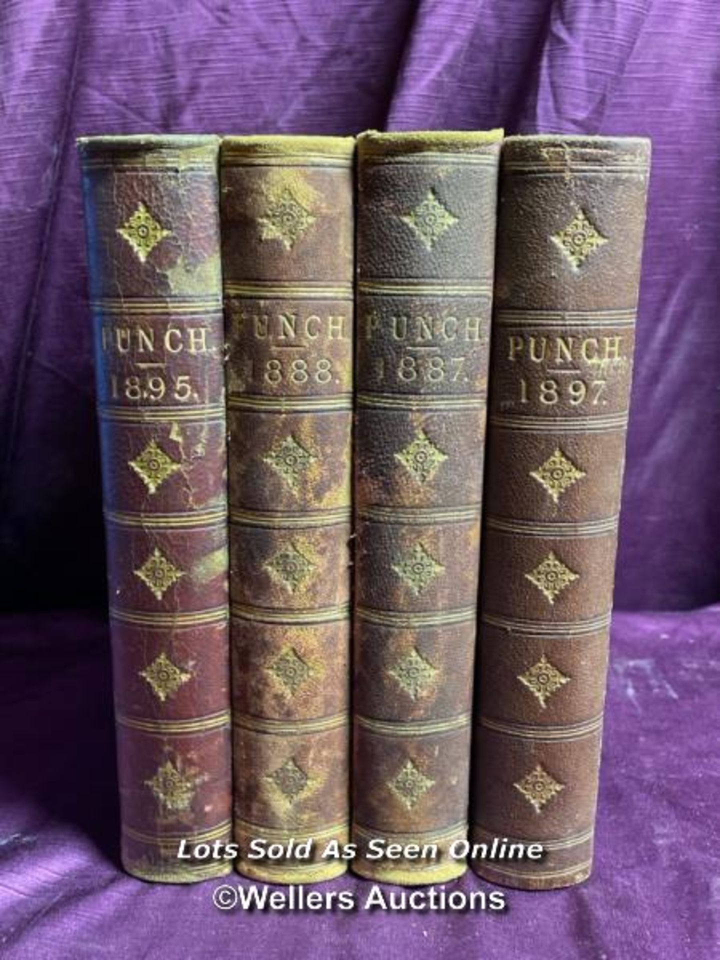 FOUR VOLUMES OF PUNCH - 1887, 1888, 1897, 1895
