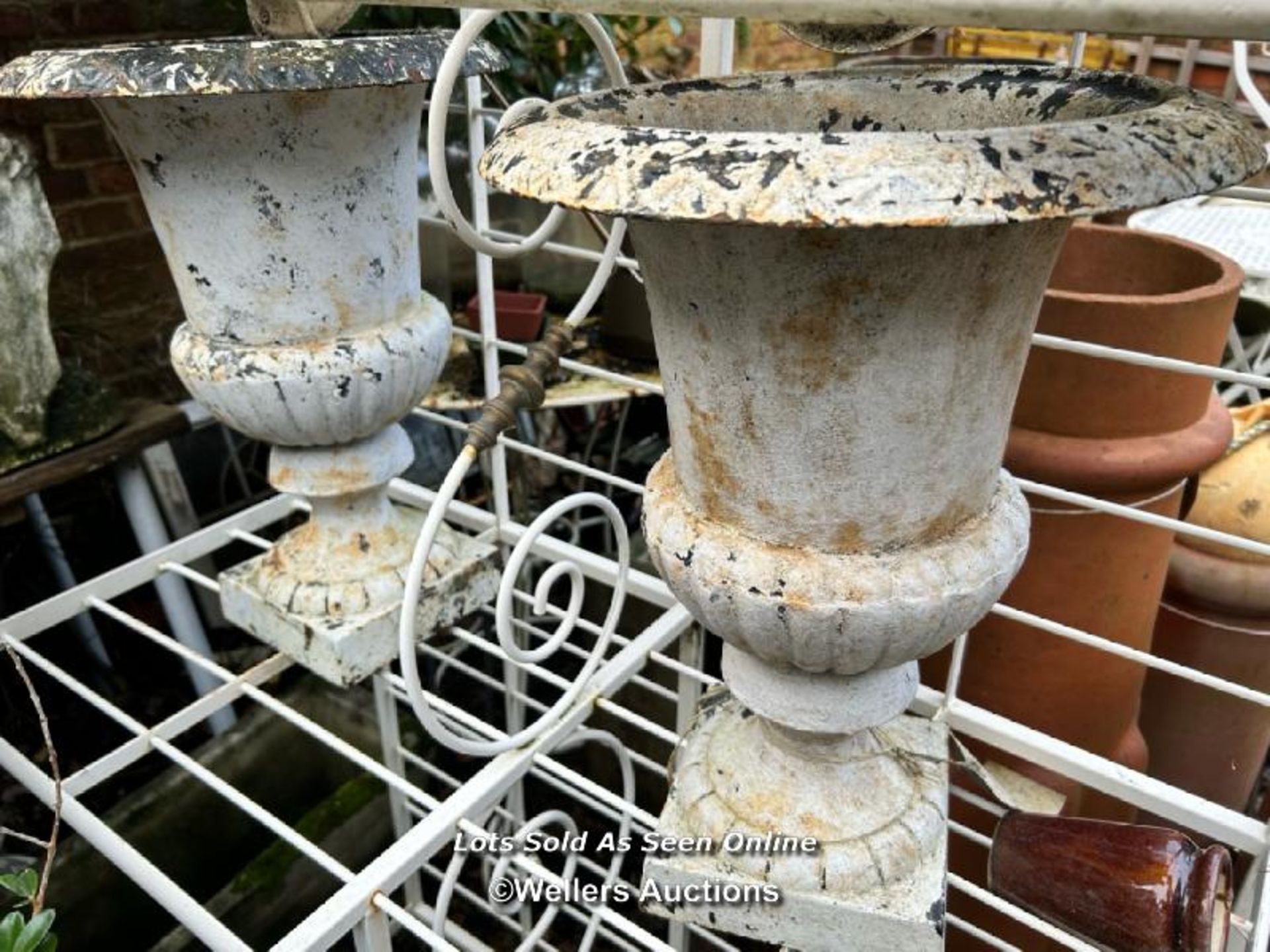 PAIR OF CAST IRON URNS