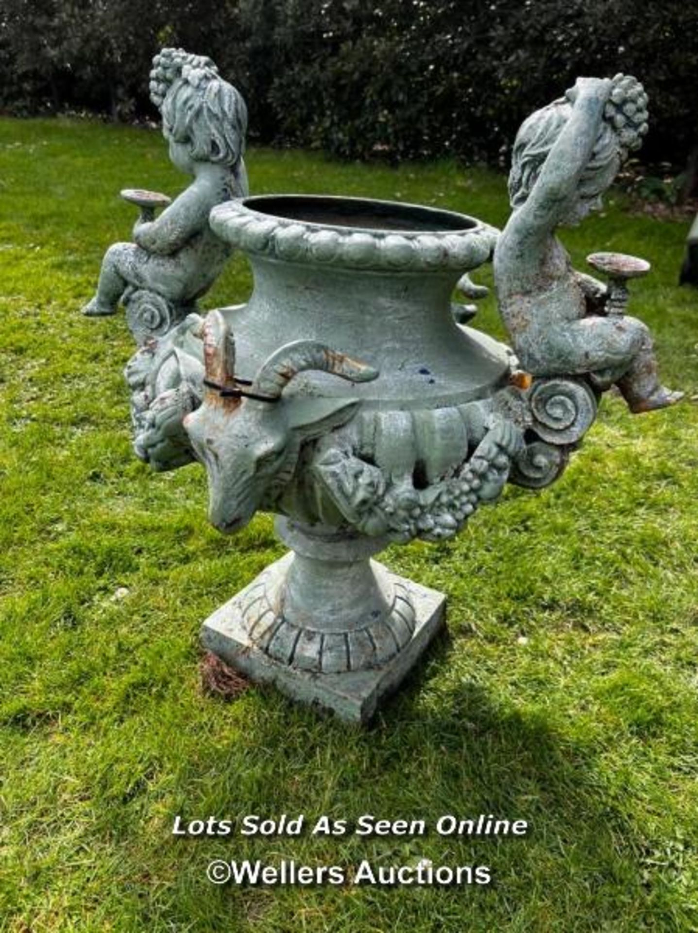 19TH CENTURY FRENCH CAST IRON URN WITH CHERUBS AND RAMS HEAD HANDLES, ONE FOOT REPIARED