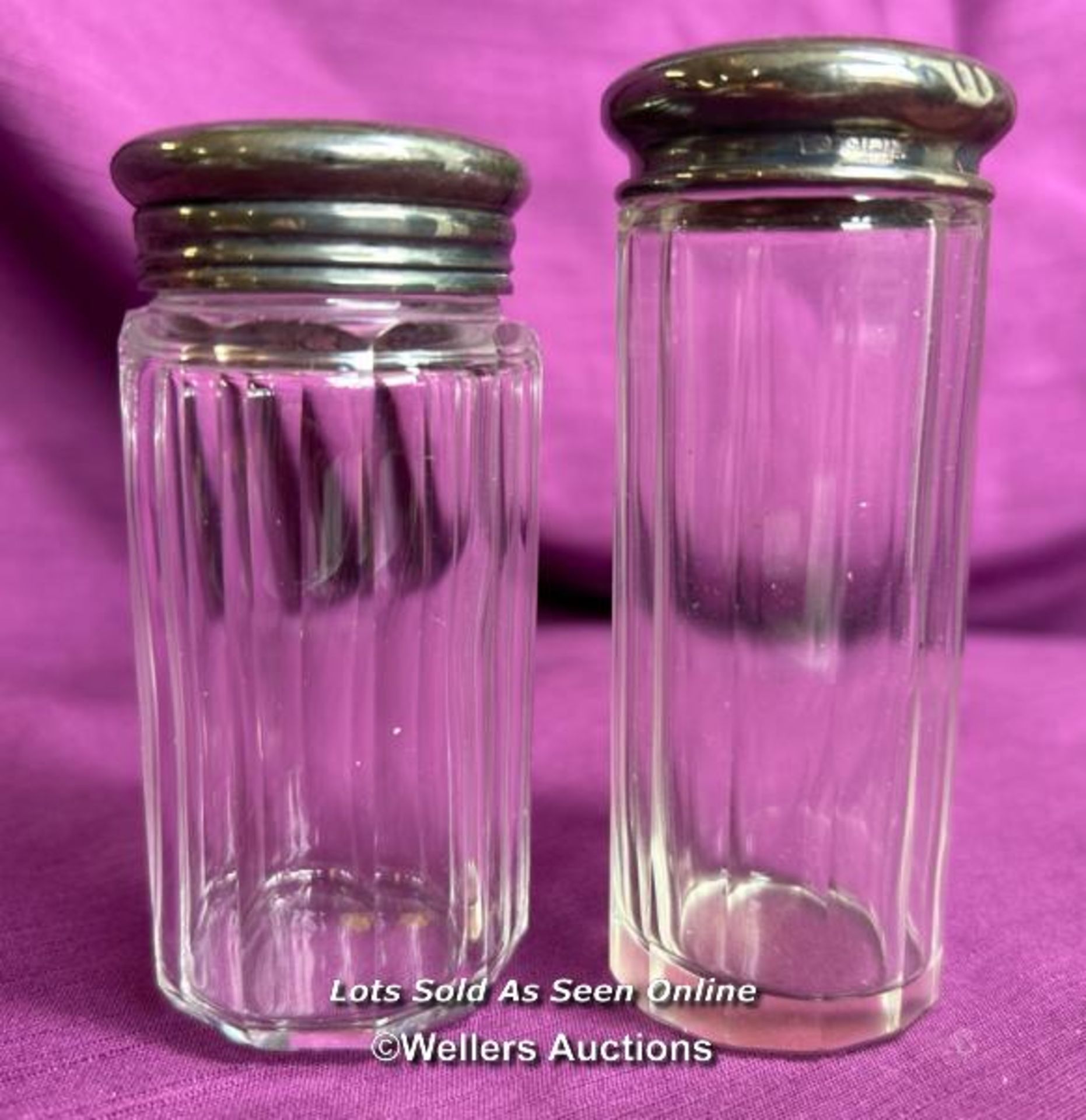 TWO HALLMARKED SILVER TOPPED AND CUT GLASS BEVELLED JARS, TALLEST 10CM, TOTAL SILVER WEIGHT 13GMS