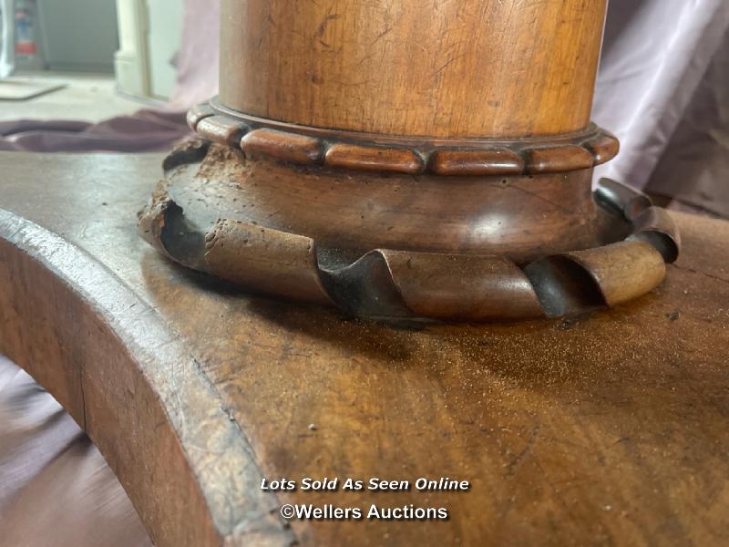 OVAL WALNUT CENTRE TABLE ON SOLID COLUMN BASE WITH FOUR DECORATIVE LEGS AND CASTORED FEET (IN NEED - Image 5 of 10