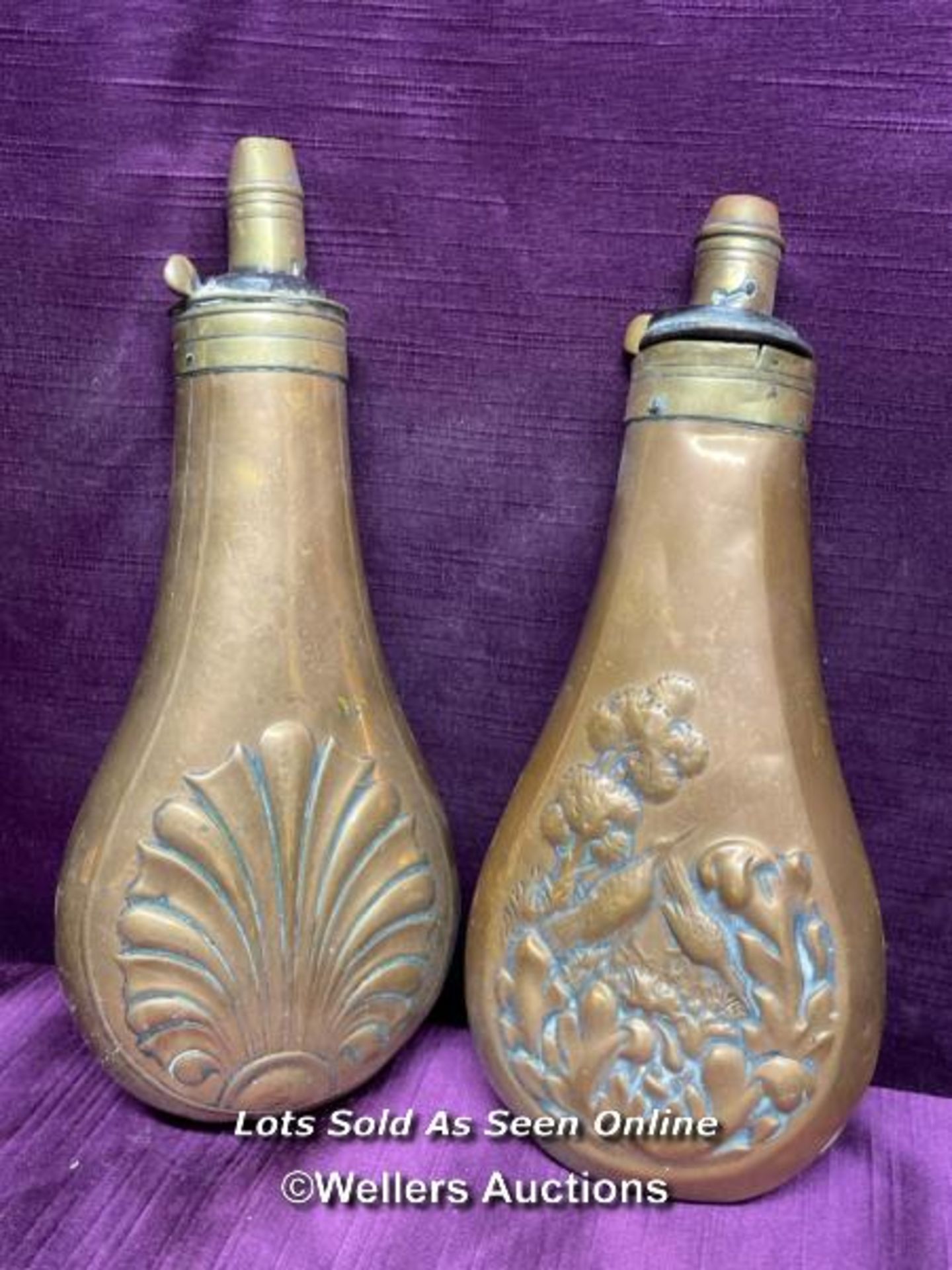 TWO 19TH CENTURY COPPER AND BRASS POWDER FLASKS, EACH 19CM