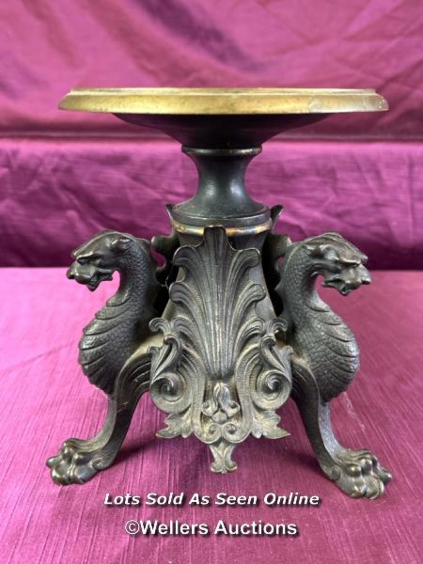 BRONZE TAZZA DECORATED WITH MYTHOLOGICAL CREATURES ON A TRI-FORM BASE, HEIGHT 19CM