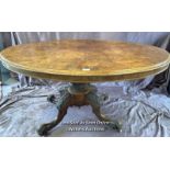 OVAL WALNUT CENTRE TABLE ON SOLID COLUMN BASE WITH FOUR DECORATIVE LEGS AND CASTORED FEET, 137 X 102