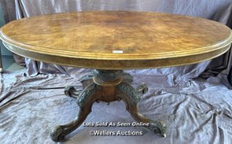 OVAL WALNUT CENTRE TABLE ON SOLID COLUMN BASE WITH FOUR DECORATIVE LEGS AND CASTORED FEET, 137 X 102