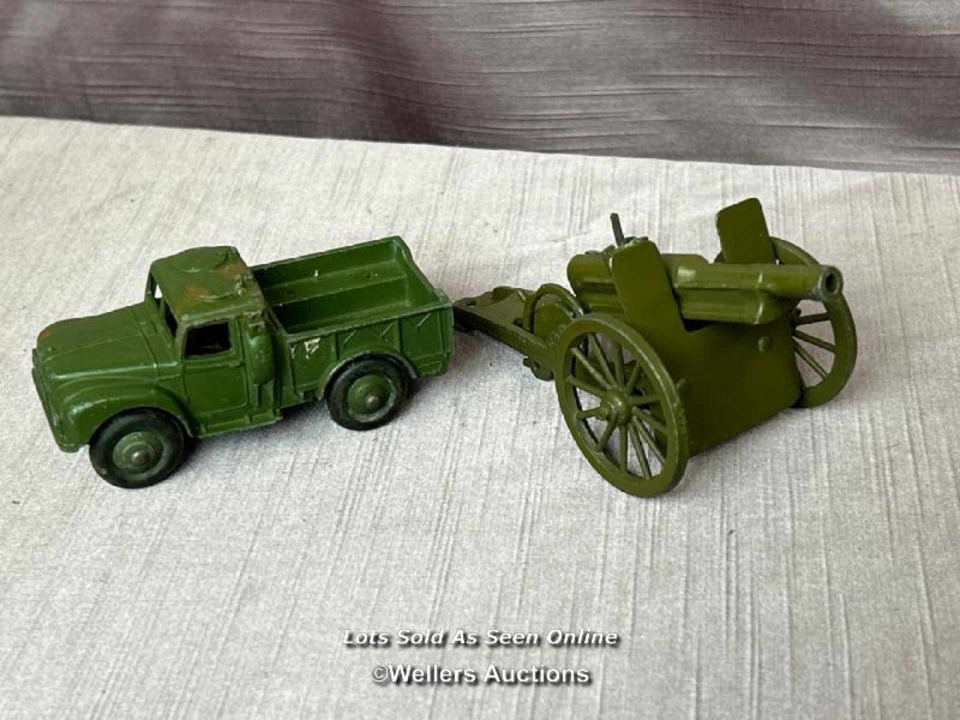 TWO DINKY DIE CAST MILITARY MODELS INCLUDING ONE TONNE CARGO TRUCK NO. 614 AND A MOBILE CANNON