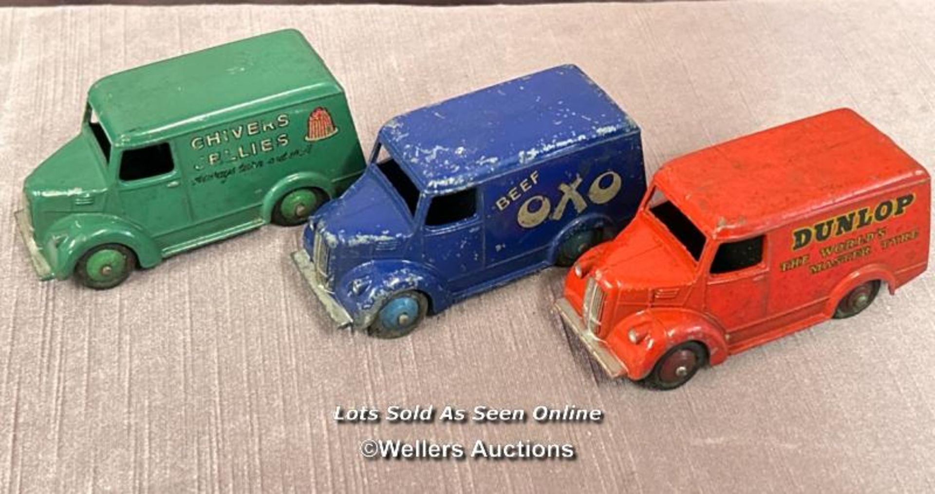 THREE DINKY TROJAN ADVERTISING VANS INCLUDING CHIVERS JELLIES, OXO AND DUNLOP