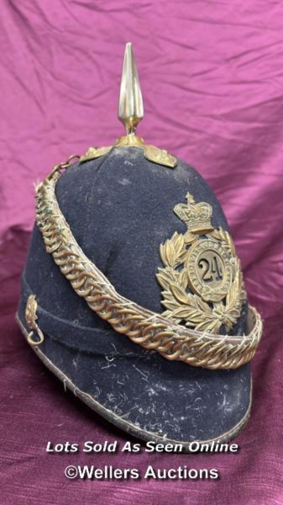 BRITISH HOME SERVICE SPIKED HELMET TO THE 24TH REGIMENT OF FOOT, APPEARS TO BE THEATRICAL
