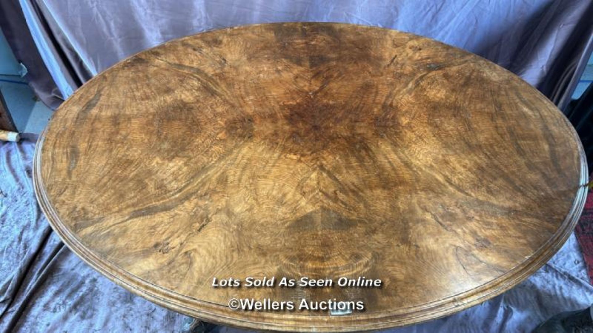 OVAL WALNUT CENTRE TABLE ON SOLID COLUMN BASE WITH FOUR DECORATIVE LEGS AND CASTORED FEET, 137 X 102 - Image 2 of 5